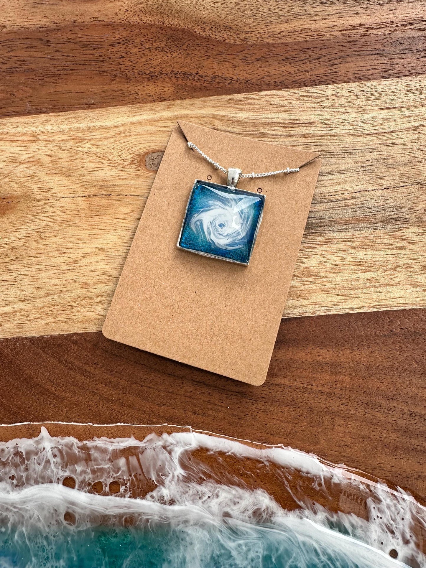 Basic Beaches Collective Resin Ocean Hurricane Pendant Necklace Resin Ocean Hurricane Pendant Necklace