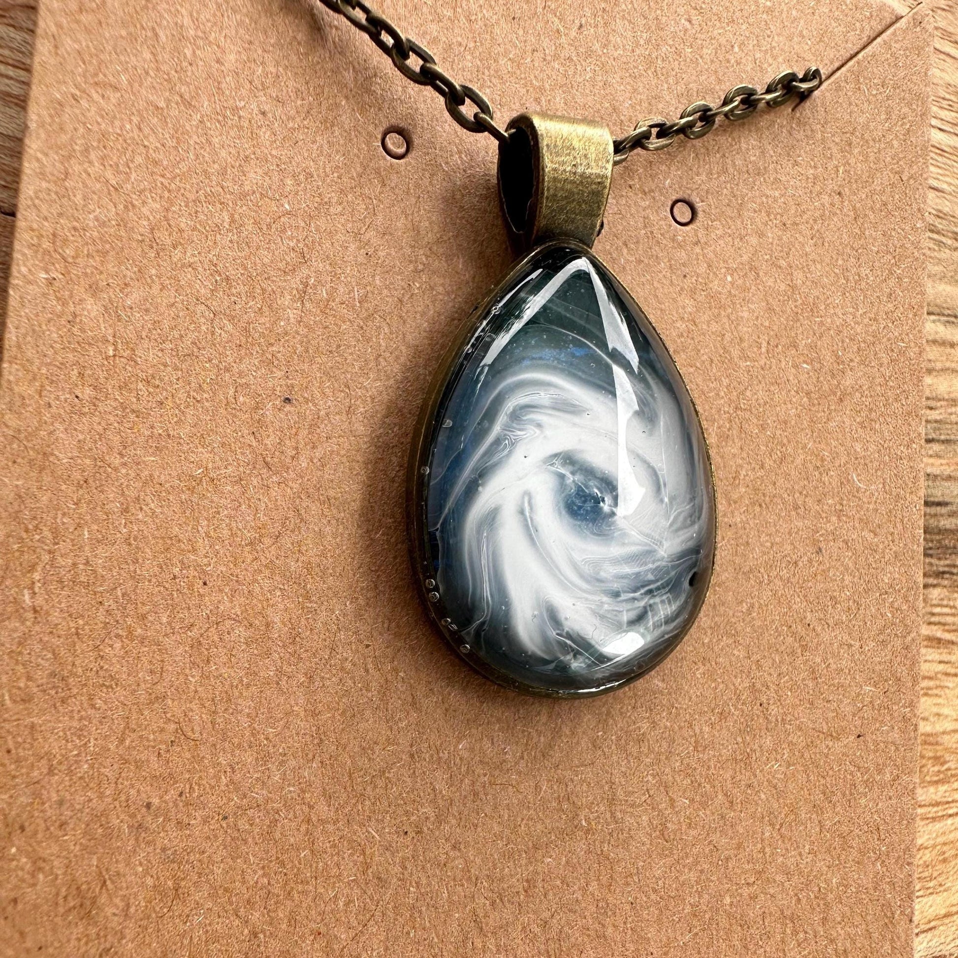 Basic Beaches Collective Resin Ocean Hurricane Pendant Necklace Resin Ocean Hurricane Pendant Necklace