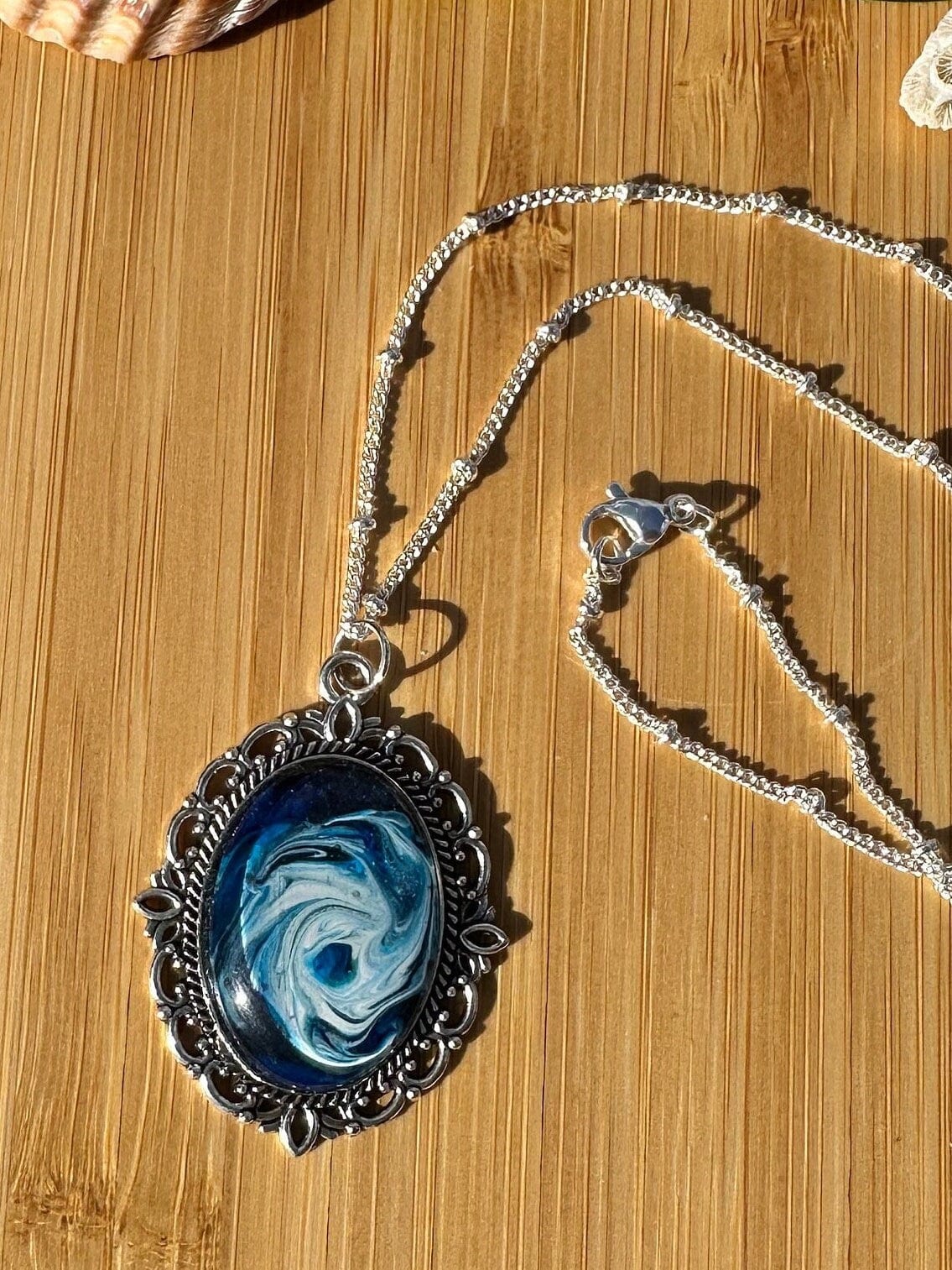 Basic Beaches Collective Resin Ocean Hurricane Pendant Necklace Resin Ocean Hurricane Pendant Necklace