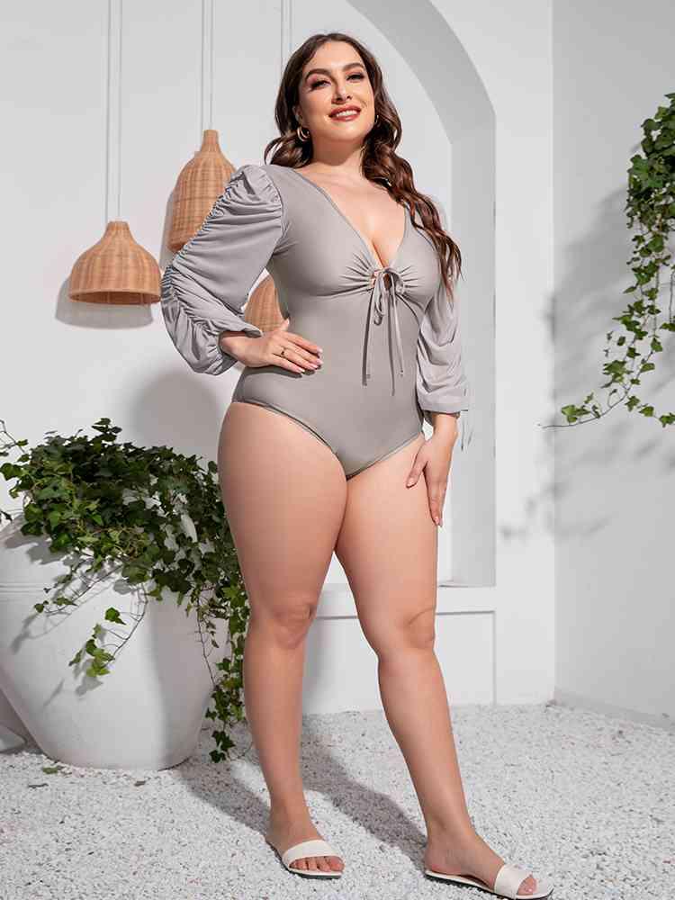 Trendsi Plus Size Tied Deep V Balloon Sleeve One-Piece Swimsuit Plus Size Tied Deep V Balloon Sleeve One-Piece Swimsuit