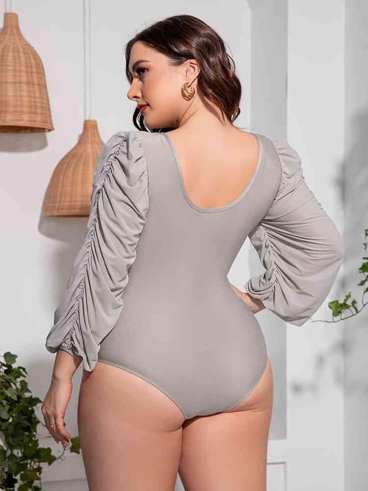 Trendsi Plus Size Tied Deep V Balloon Sleeve One-Piece Swimsuit Plus Size Tied Deep V Balloon Sleeve One-Piece Swimsuit