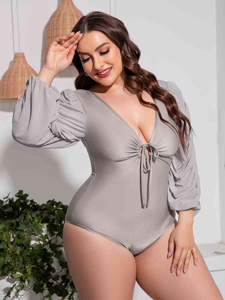 Trendsi Plus Size Tied Deep V Balloon Sleeve One-Piece Swimsuit Plus Size Tied Deep V Balloon Sleeve One-Piece Swimsuit