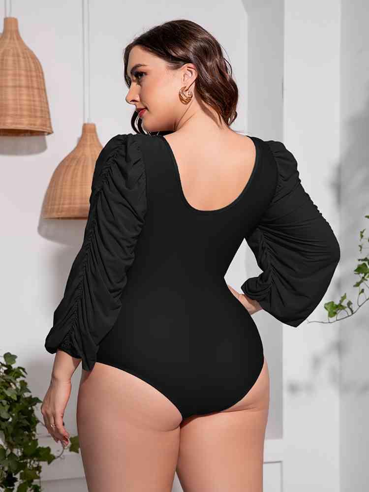 Trendsi Plus Size Tied Deep V Balloon Sleeve One-Piece Swimsuit Plus Size Tied Deep V Balloon Sleeve One-Piece Swimsuit